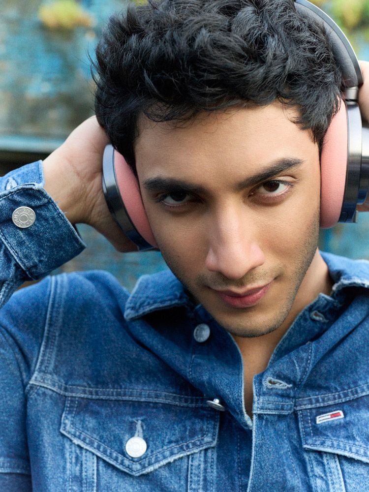 Vedang Raina wears Dyson OnTrac headphones and a Tommy Hilfiger denim jacket