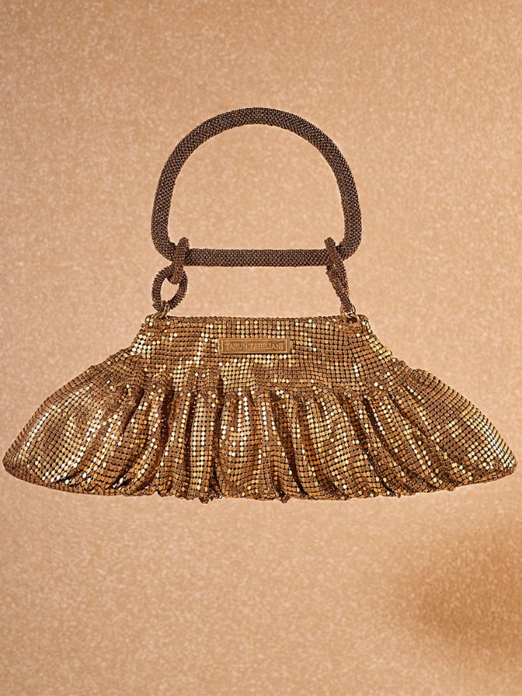 A golden chainmail party bag by Tarun Tahiliani