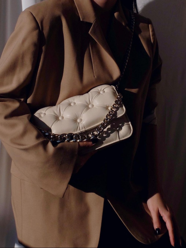 A woman holding the Carmen bag by Italian designer Benedetta Bruzziches