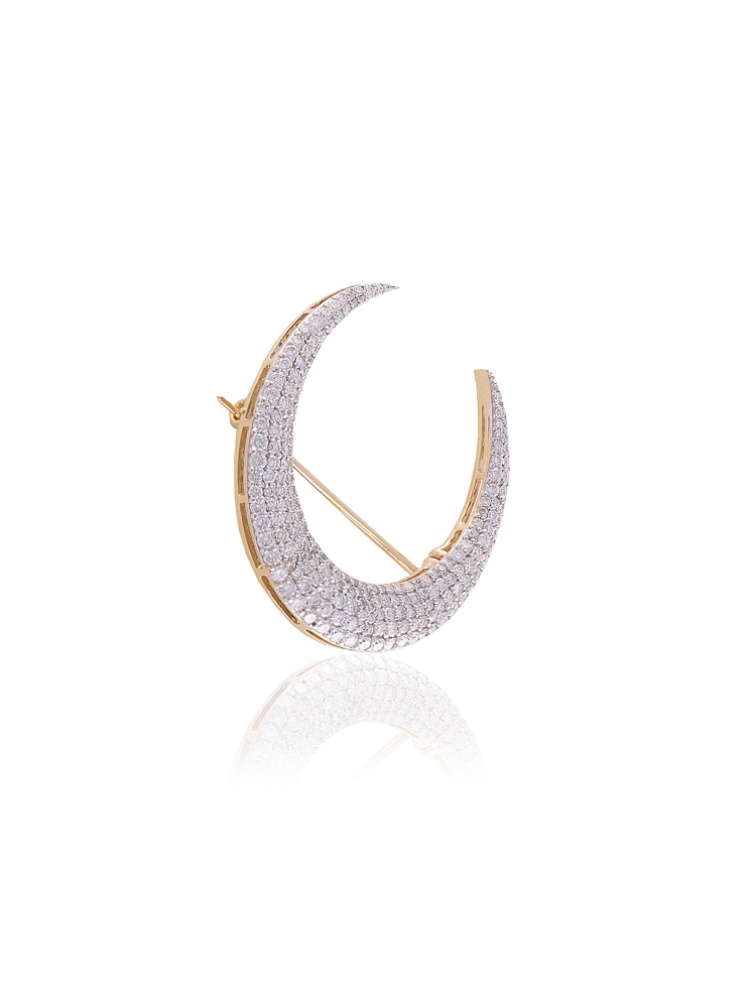 A diamond-studded crescent shaped pin by Mahesh Notandass