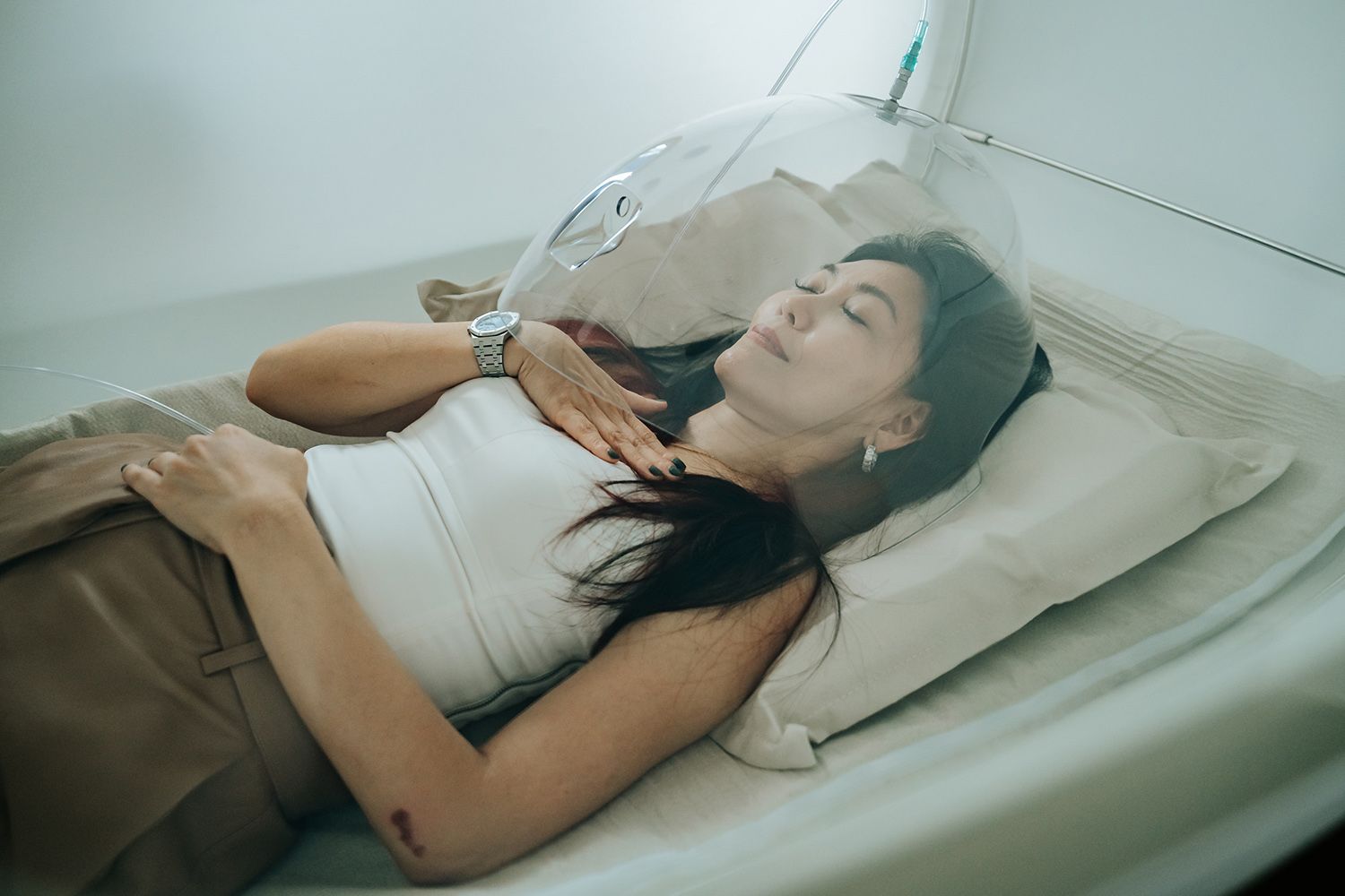 A woman in a hyperbaric oxygen chamber