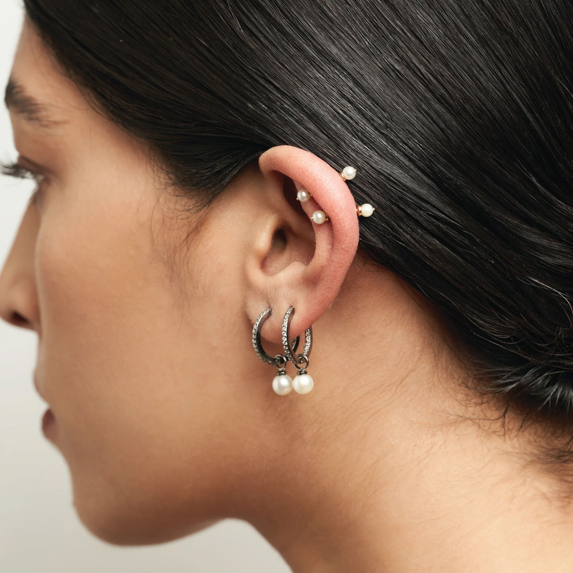 A woman with multiple ear piercings